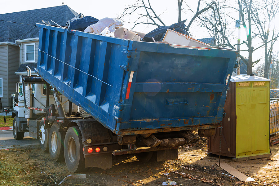 A truck with a dumpster loaded with the trash in Danbury, Connecticut.
